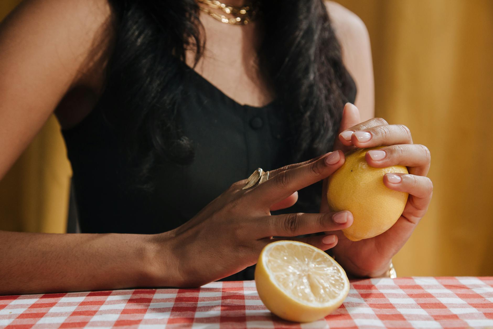 A blue vibrator surrounded by flowers and citrus slices on a colorful background, symbolizing fresh approaches to intimacy