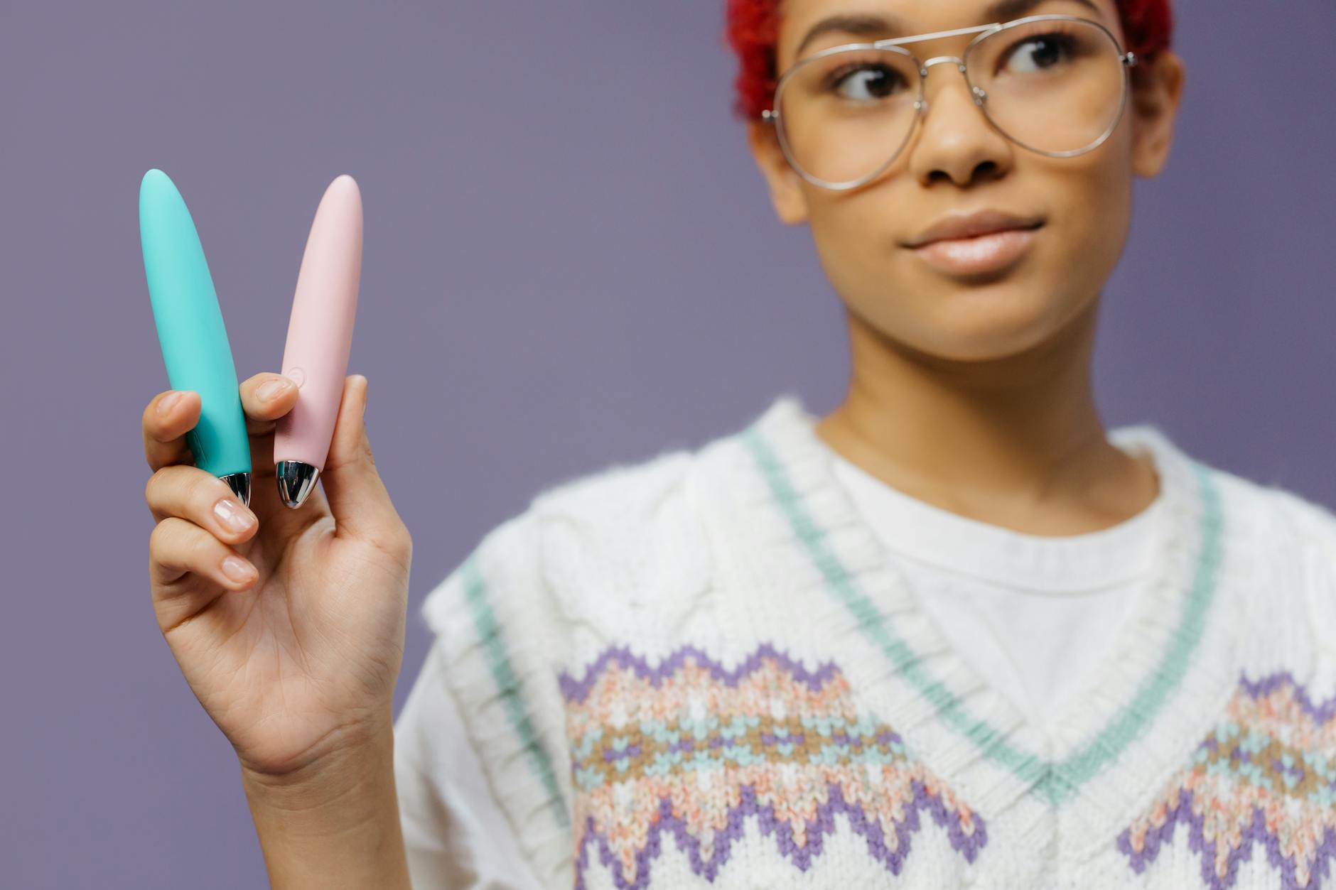 Woman holding lemon clitoral vibrators demonstrating modern intimate wellness
